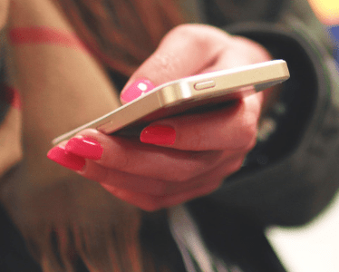 Person booking on phone