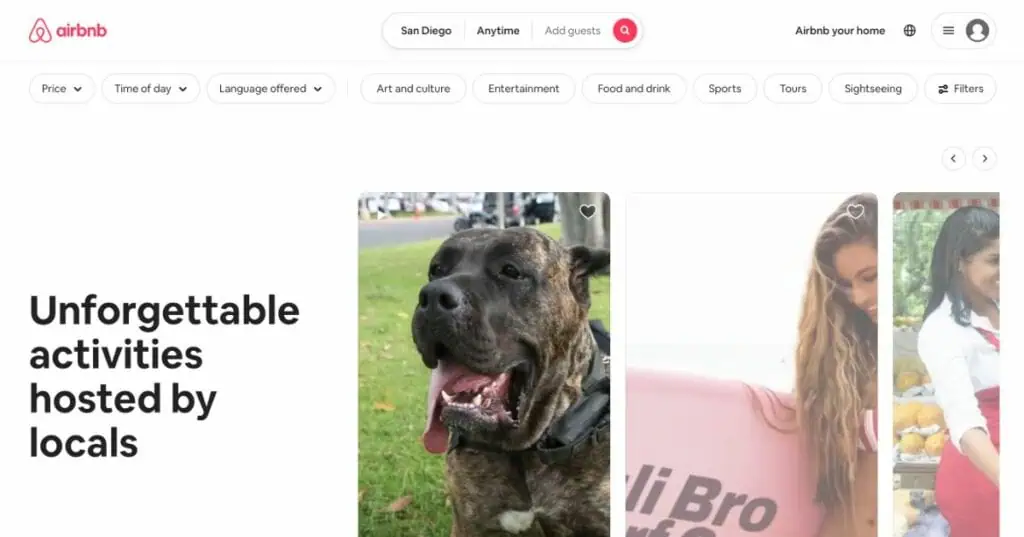 Airbnb website showing search options for San Diego, with filters and a section titled "Unforgettable activities hosted by locals" featuring images of a dog and people.